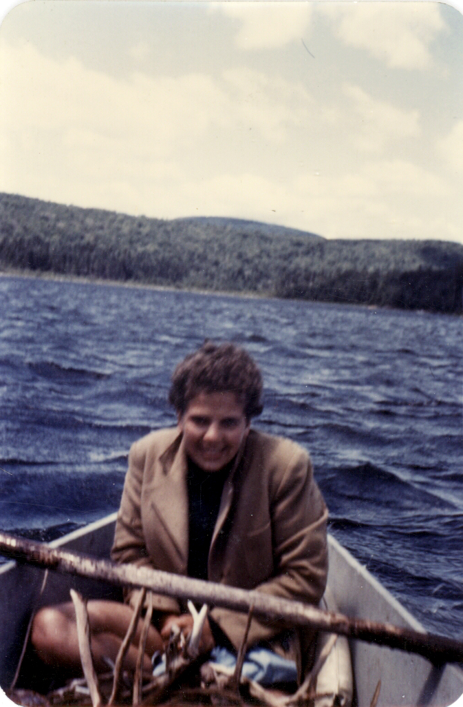 Mom & Dad's honeymoon. He took her canoeing. That's driftwood in front of her.