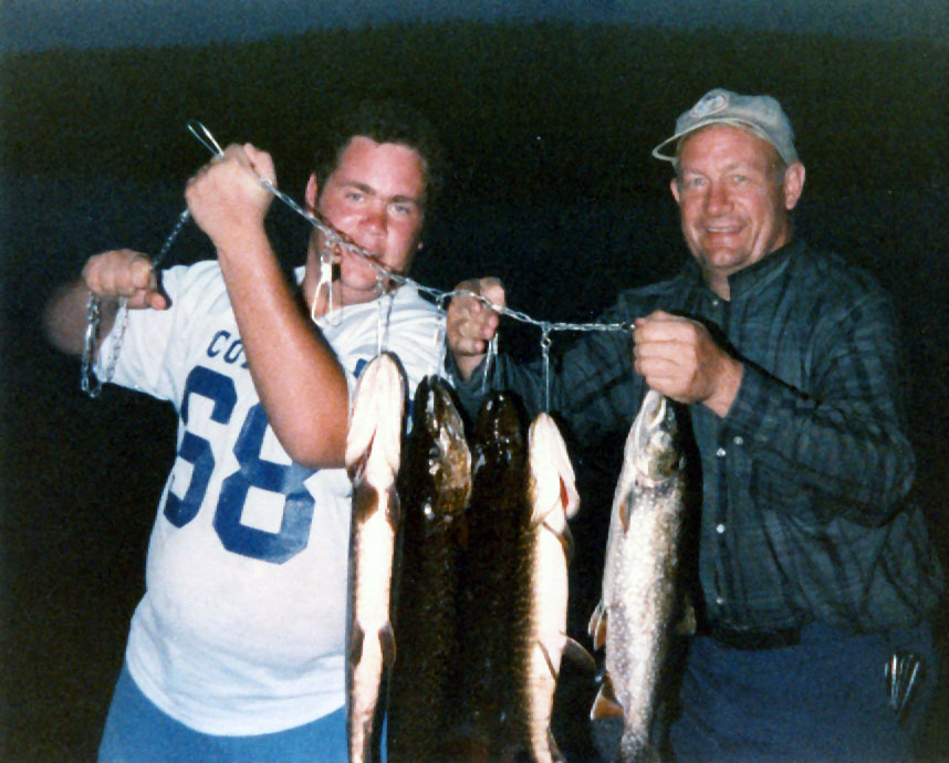 Jim doesn't love fishing either, but here he is with Dad on our last family trip to Canada. They had fun.